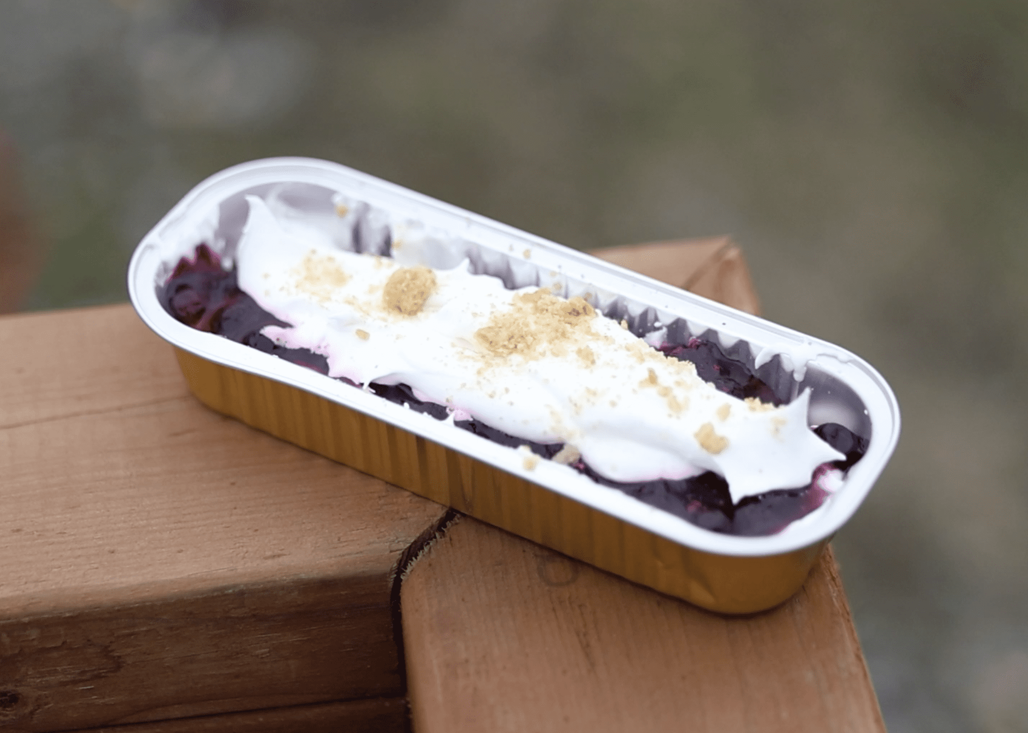 A metal tin with blueberry delight, a sweet treat with graham cracker, whipped cream and blueberries. Ben Townsend photo.